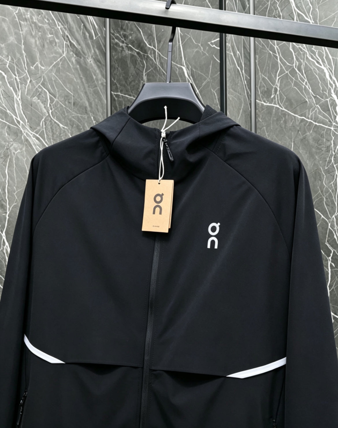 On QC windbreaker jacket